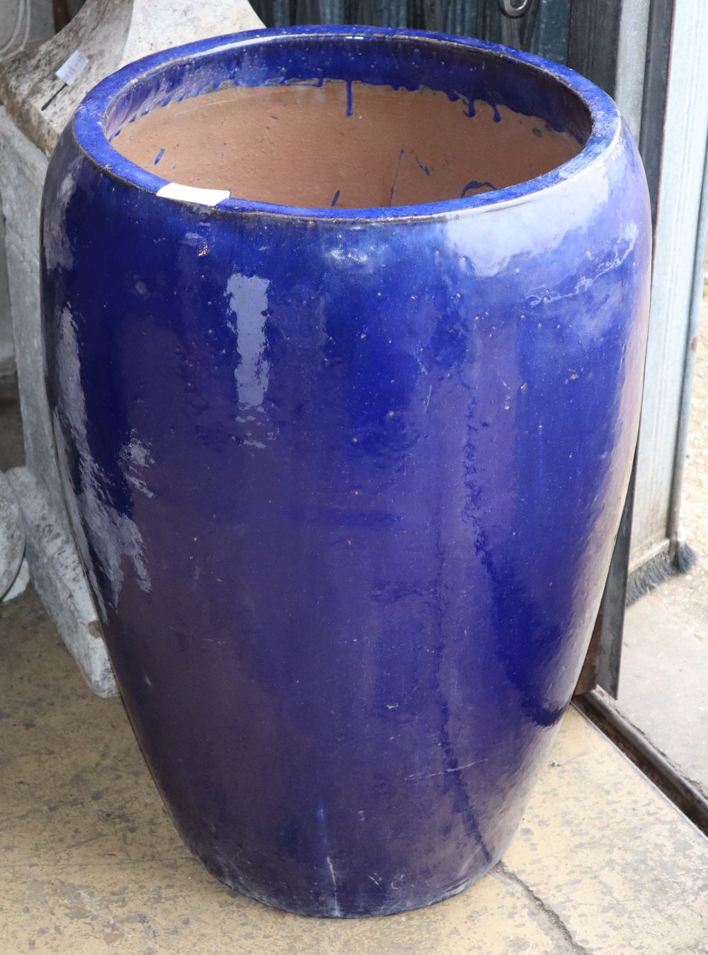 A large blue glazed garden planter, 48cm diameter